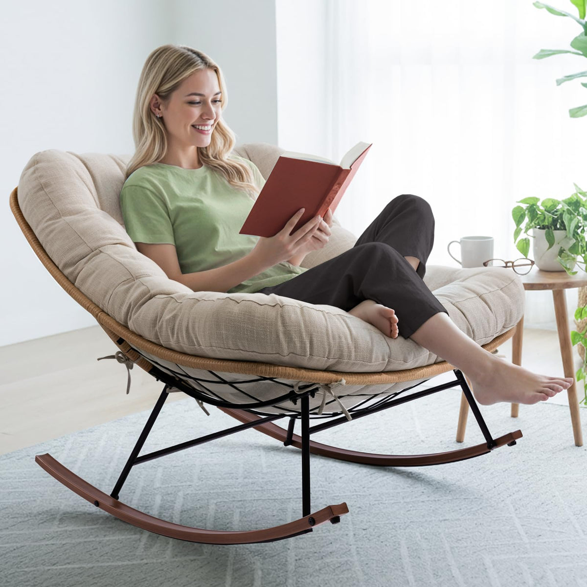 Metal moon rocking chair with beige cushion and wood-texture frame for relaxed seating