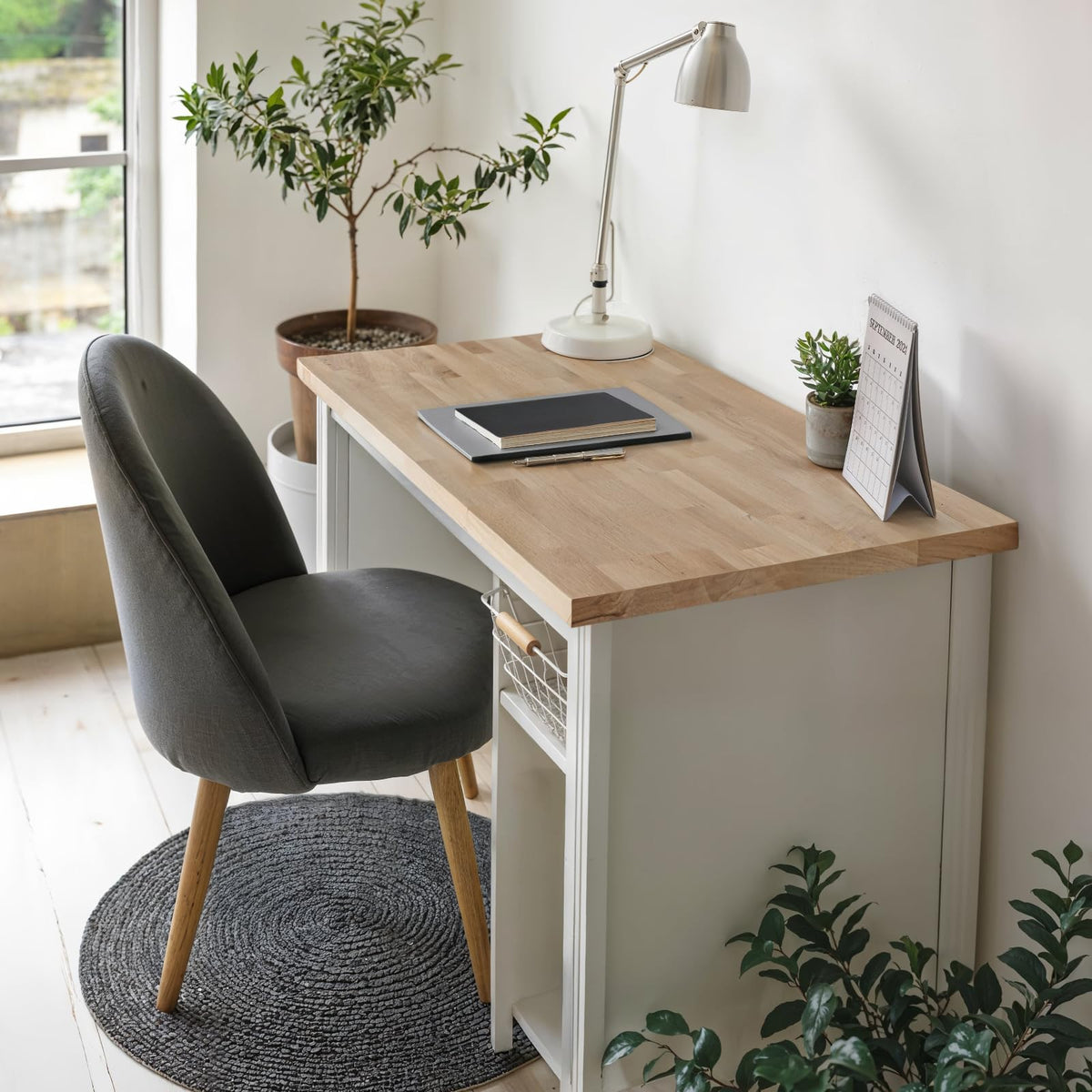 Acacia wood butcher block countertop designed with 36 in x 25 in x 1.5 in and unfinished for desktop applications