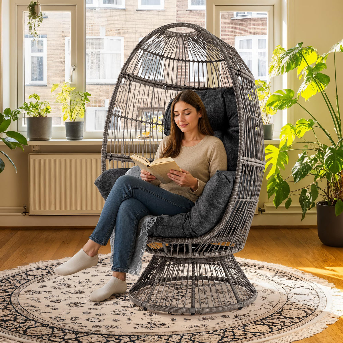 Teardrop papasan chair with onyx stone cushion, multi dark brown frame, and teardrop design for indoor lounge seating